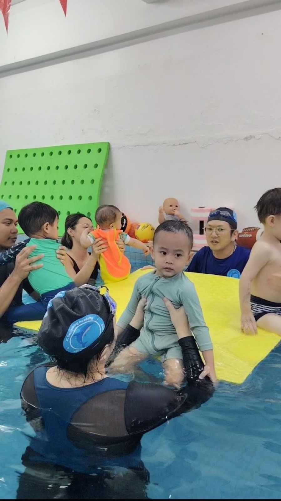 Parent and toddler enjoying a Baby & Toddler class on a float mat