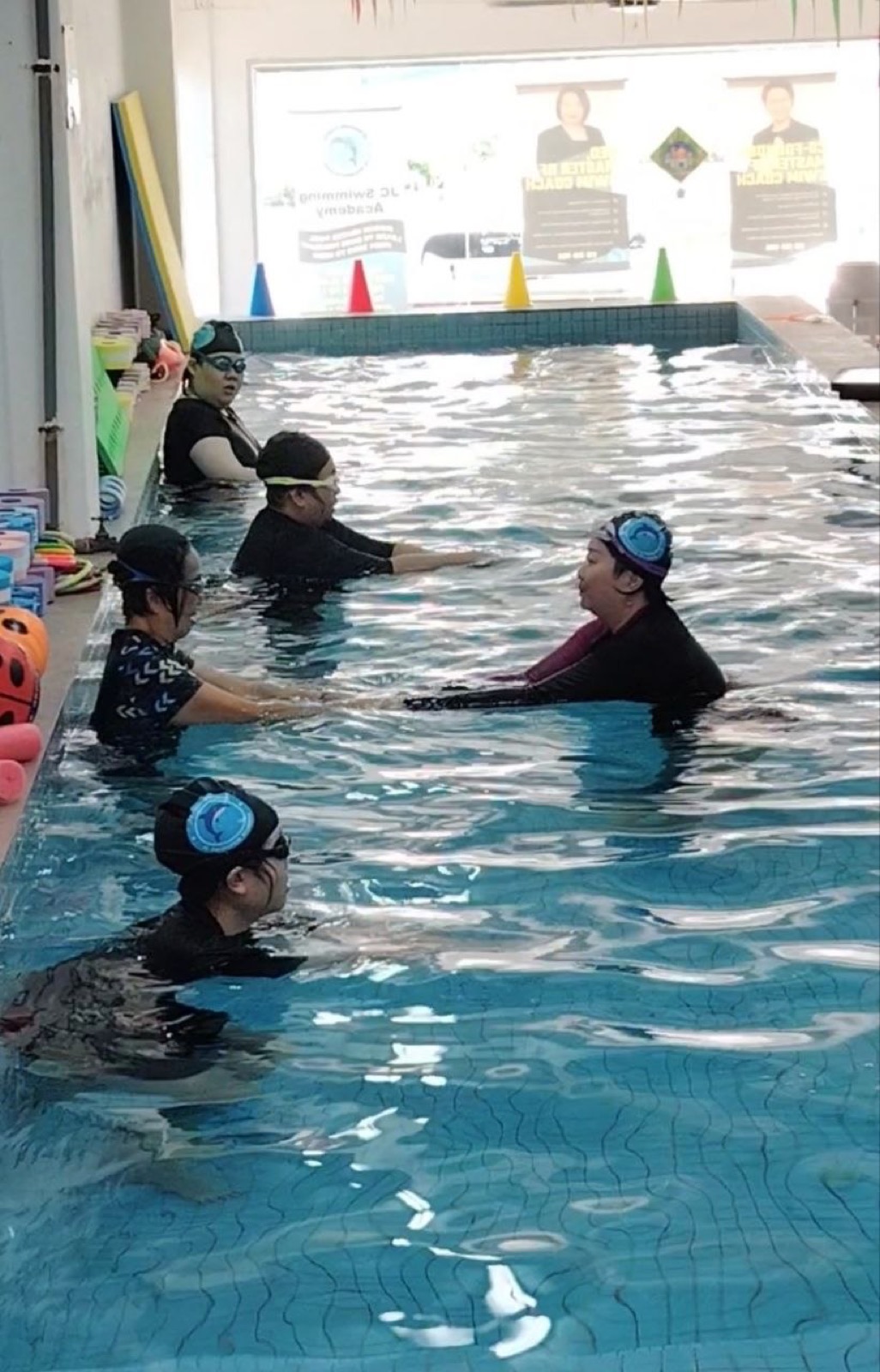 A JC Swimming Academy coach demonstrating correct technique during the Teacher Training Course
