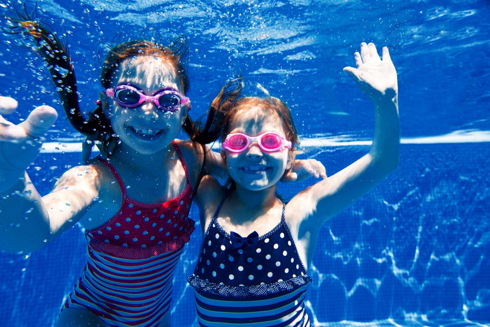 Happy kids smiling underwater