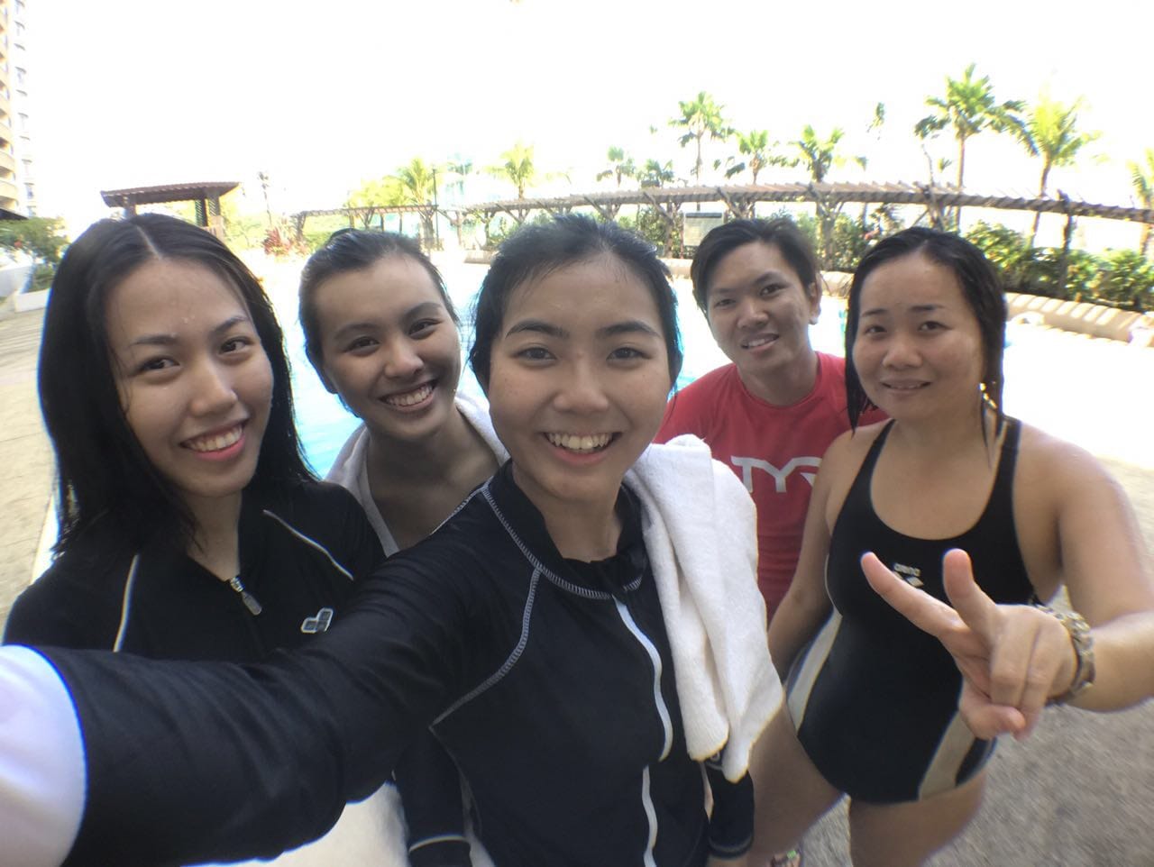 Young swimmers proudly holding their Water Confidence certificates